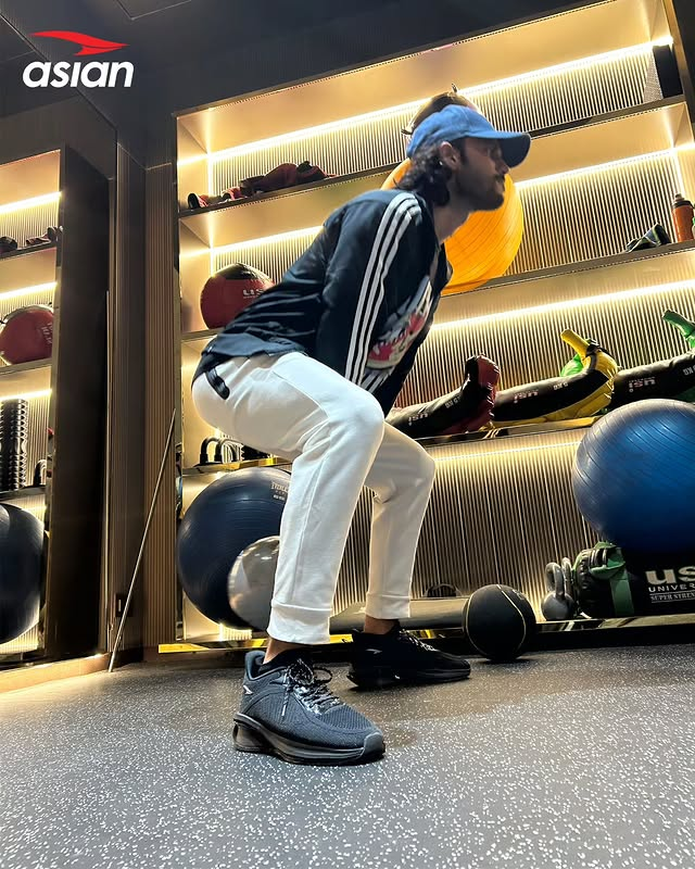 Man exercising in Powerplay shoes from Asian Footwears.