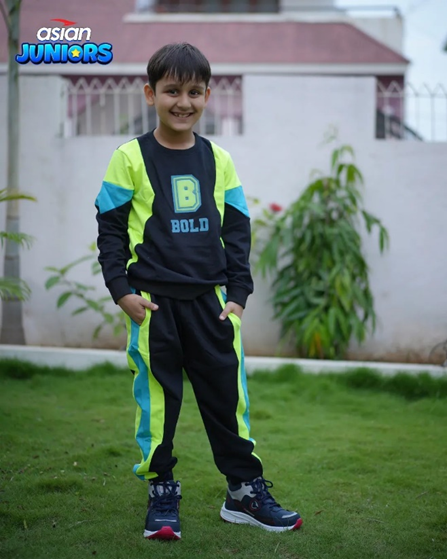 Kid wearing Asian Footwears Adventure lightweight sports shoe.