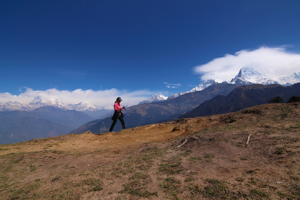 Woman trekking on mountains.